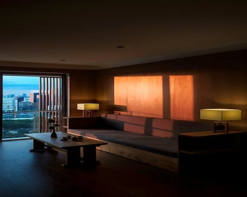 Comfortable living room illuminated by warm evening light in Mexico City